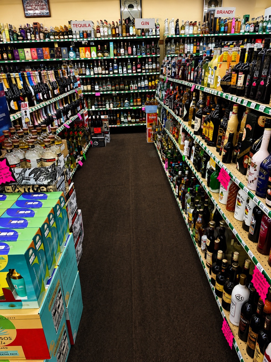 Oscar's Package Store cold beer coolers and stocked shelves